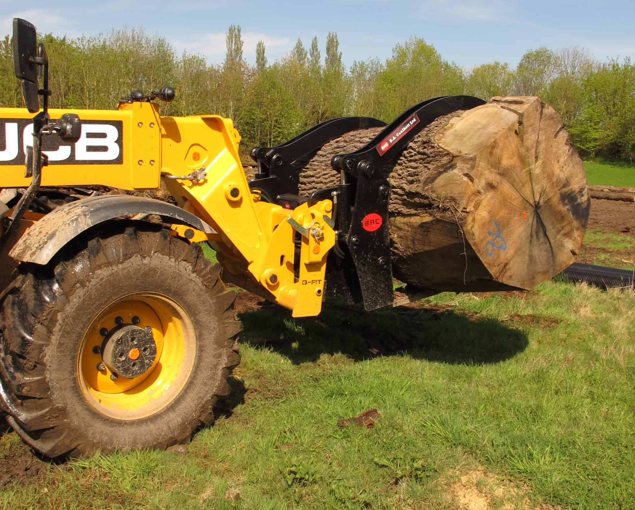 Log Grabs BA Cau;lkett with log