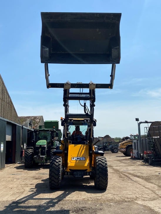 High Tip Bucket With Safety Feature on JCB B. A. Caulkett outside looking front onto raised bucket