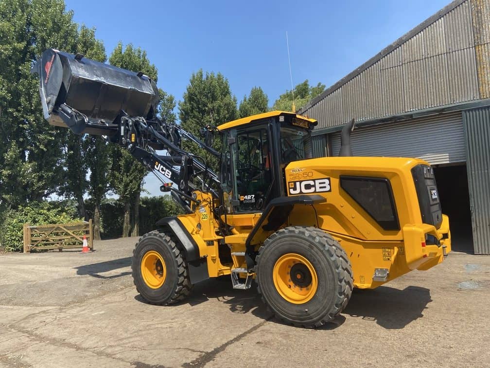 High Tip Bucket With Safety Feature on JCB B. A. Caulkett outside storage shed - Loading Shovel Attachments