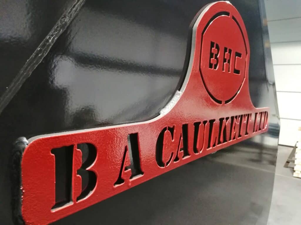 High Tip bucket 8.2m B. A. Caulkett side showing logo