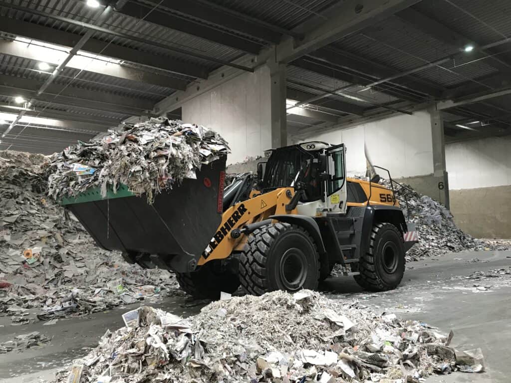 Waste Handling B. A. Caulkett High Tip Bucket in action in waste handling site