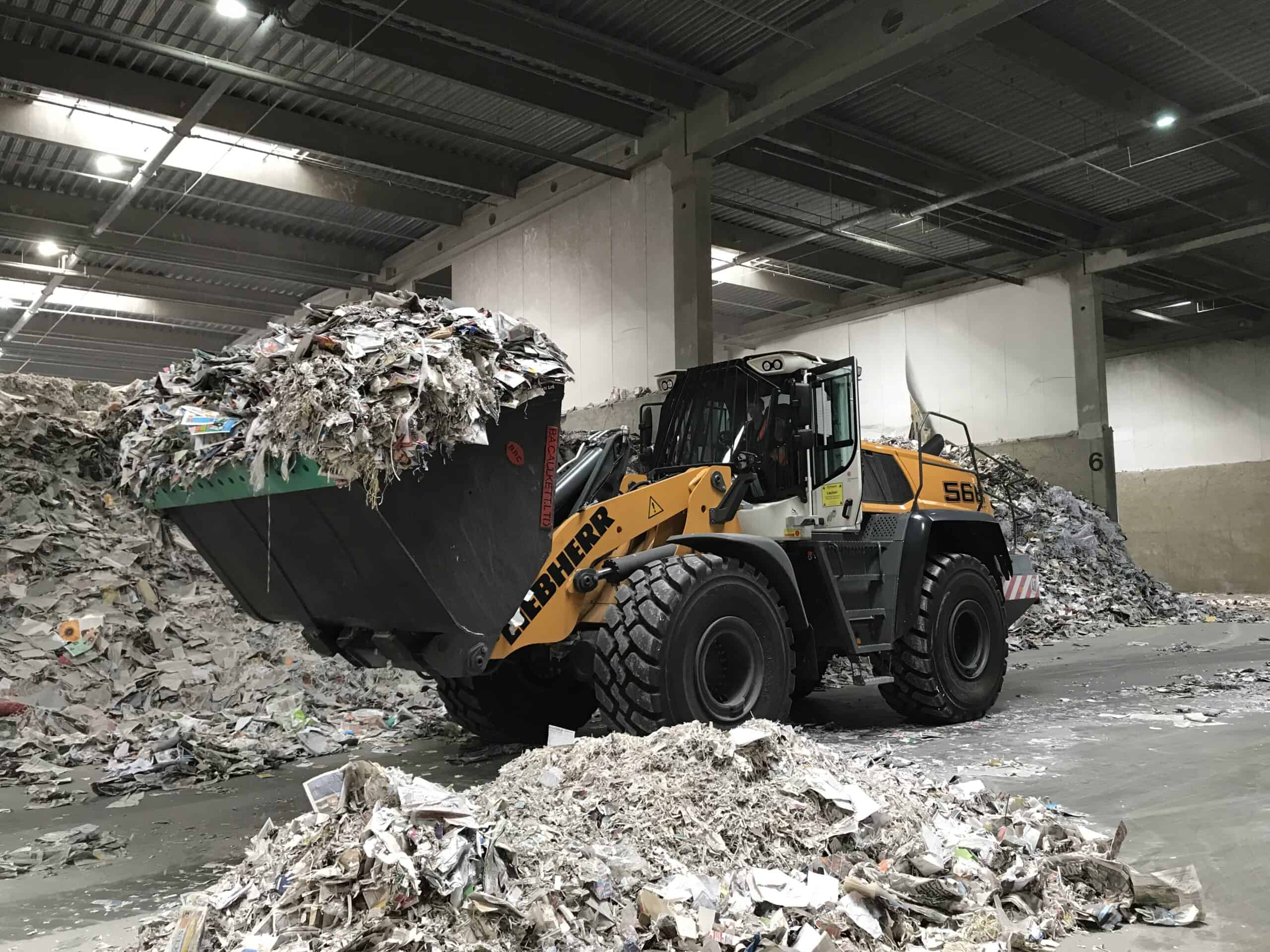 Waste Handling B. A. Caulkett High Tip Bucket in action in waste handling site