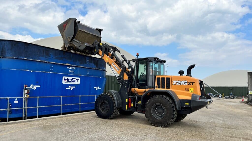High Tip Bucket on Case721Gxt B. A. Caulkett tipping into container 14