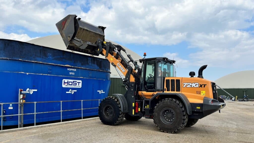 High Tip Bucket on Case721Gxt B. A. Caulkett tipping into container