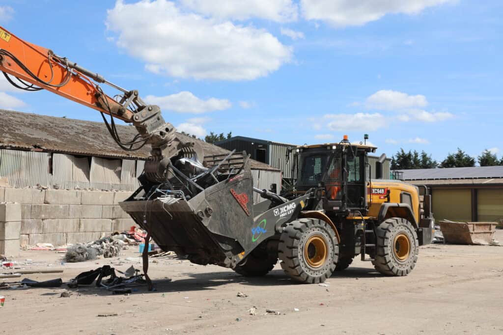 BA Caulkett High Tip Bucket on XCMG XC948 Wheel Loader lhs moving loaded grab