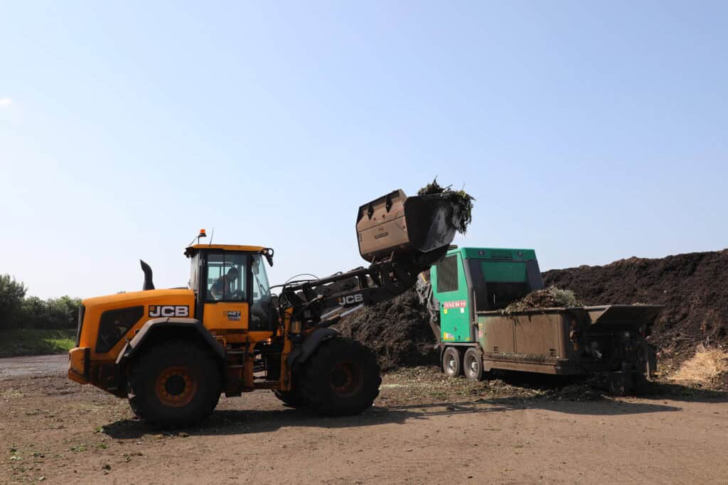 BAC High Tip Bucket on JCB 427 loading green waste